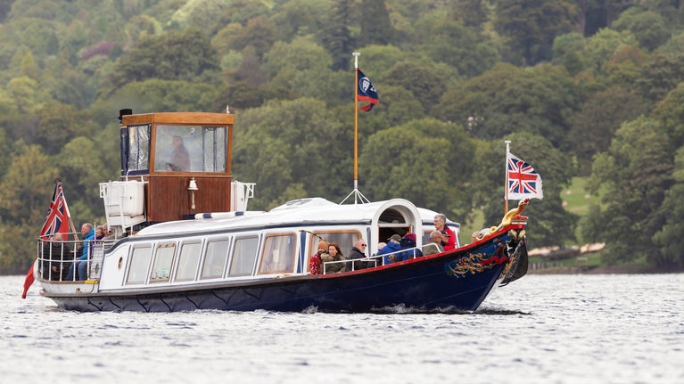 Passengers enjoying a trip on the Steam Yacht Gondola, Coniston, Lake District